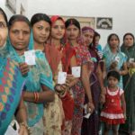 the-women-voters-standing-in-a-queue-to-cast-their-votes-at-a-polling-booth-during-the-9th-phase-of-general-elections-2014-in-varanasi-uttar-pradesh-o1